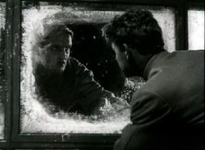 Kneishitz (left) glares at Martinov (right) through an icy window (Circus)