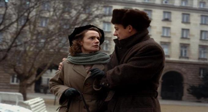 Marie and Aleksei wear drab Soviet clothing (East-West)